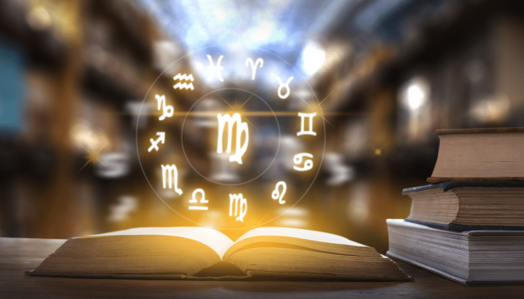 livre ouvert avec l’horloge des horoscopes